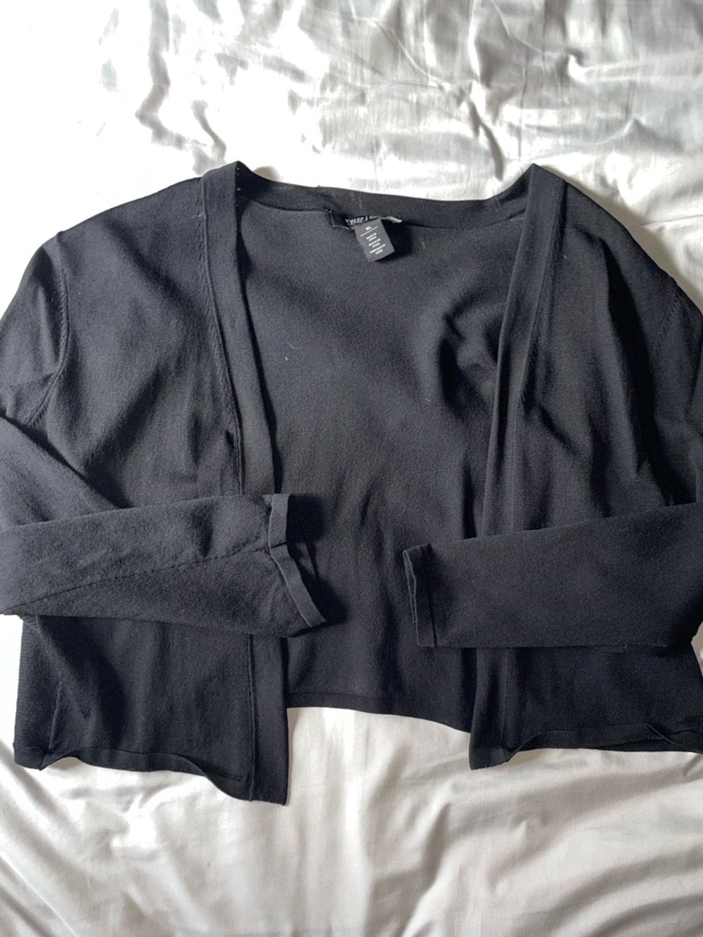 Black WHBM Women's Open-Front Cropped shrug.